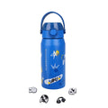 A blue insulated water bottle with a matching blue carry handle lid, decorated with cartoon graphics including a skateboard, stars, and a crown. Four small accessory charms are arranged below the bottle on a plain white background.