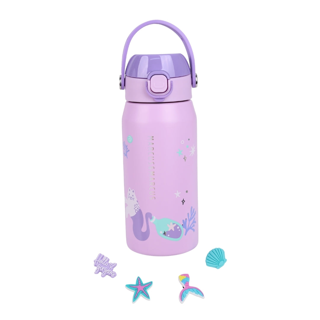 A light purple insulated water bottle with a matching purple carrying loop lid, decorated with mermaid and sea creature illustrations. It is shown on a clean white background with three small mermaid-themed accessories placed below it.